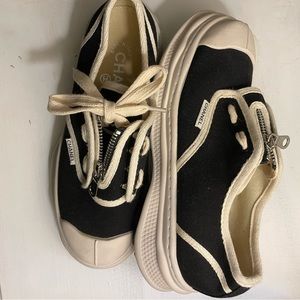 Black and white Chanel sneakers